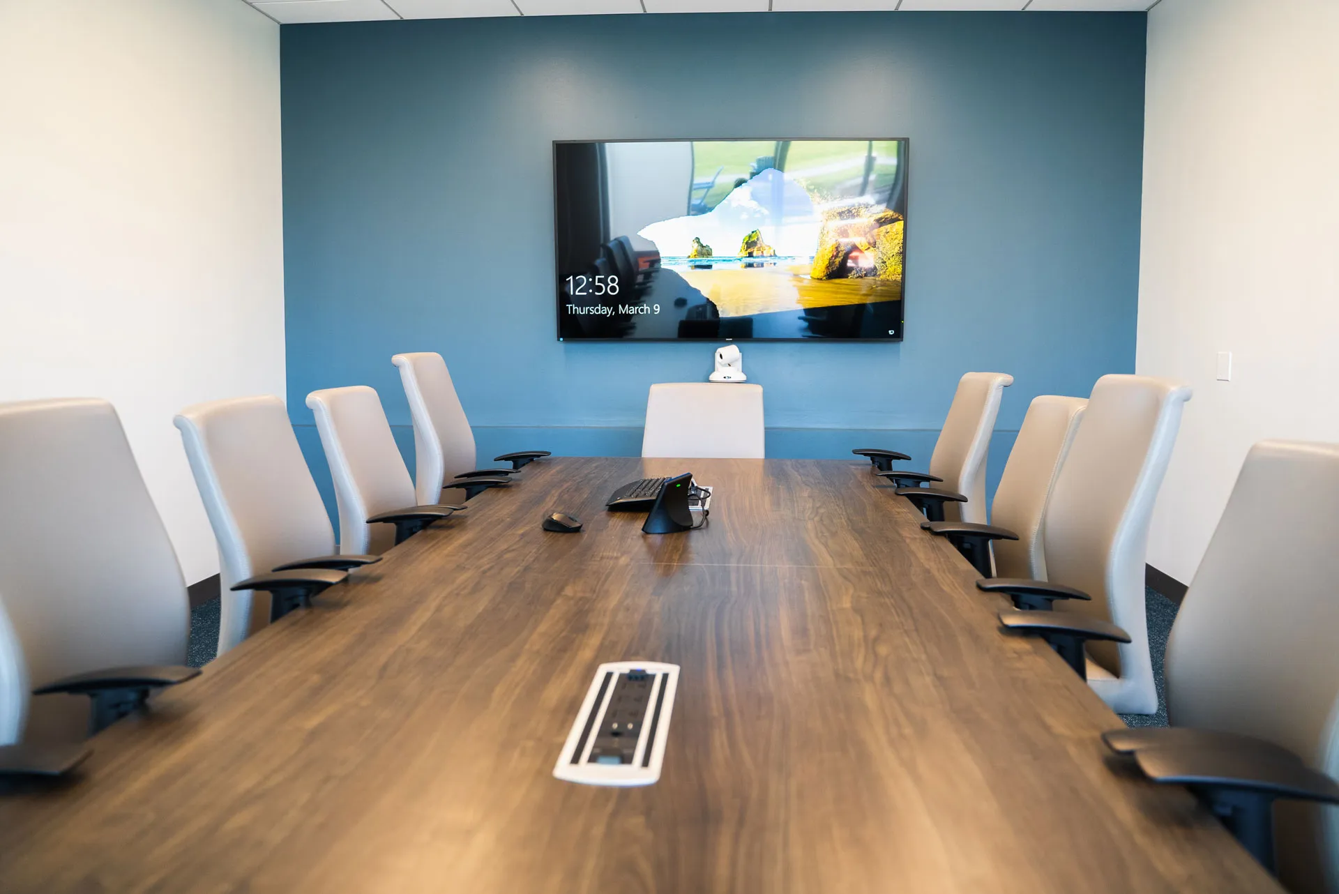 Modern conference room with large display and video conferencing setup