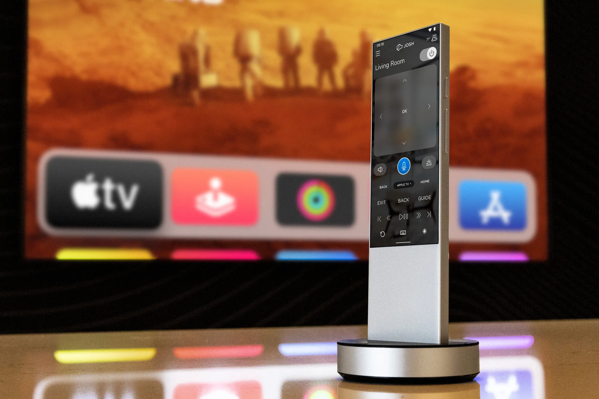 Josh.ai remote docked beside an Apple TV-based media setup